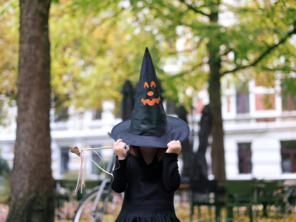 Lady wearing Witch-themed costumes